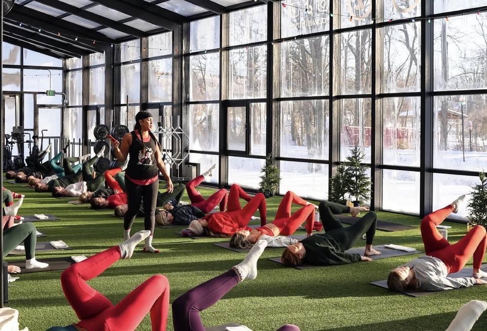 A winter class in the Ozwell dome, with Christmas trees inside and snow outside